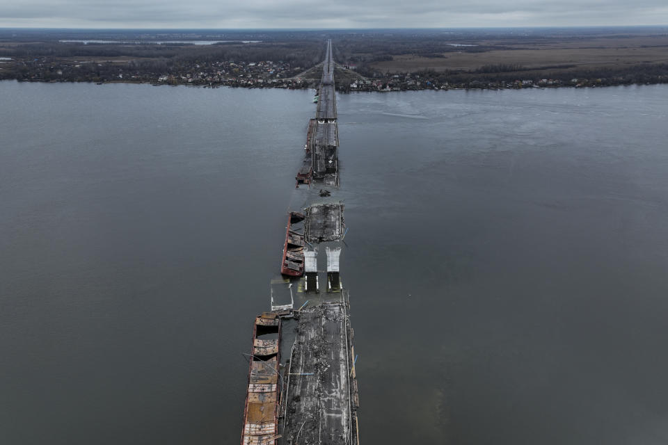 General view of the damaged Antonivsky Bridge in Kherson, Ukraine, Sunday, Nov. 27, 2022. The bridge, the main crossing point over the Dnipro river in Kherson, was destroyed by Russian troops in earlier November, after Kremlin's forces withdrew from the southern city. (AP Photo/Bernat Armangue)