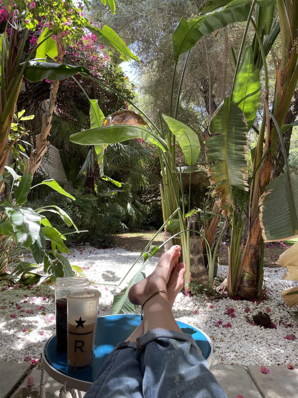 The author lounging outside on the room patio