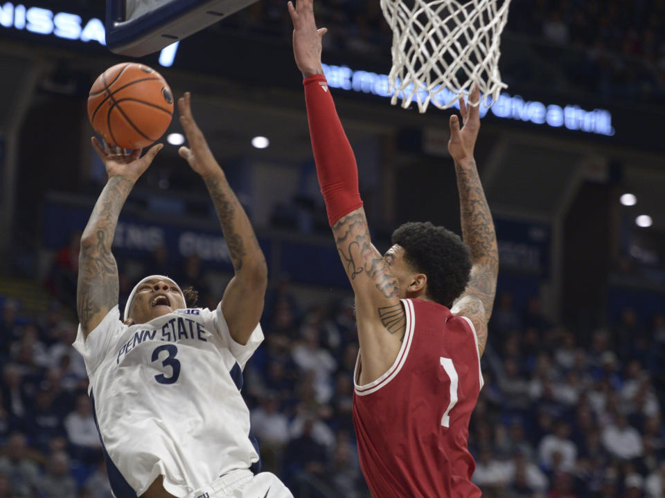 Penn State's Nick Kern Jr. (3) shoots over Indiana's Kel'el Ware (1) during the first half of an NCAA college basketball game Saturday Feb. 24, 2024, in State College, Pa. (AP Photo/Gary M. Baranec)