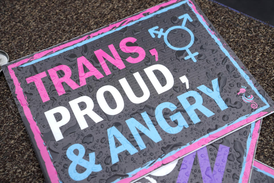 A placard supporting transgender rights is shown at the Stonewall Pride Parade and Street Festival, Saturday, June 17, 2023, in Wilton Manors, Fla. (AP Photo/Lynne Sladky)