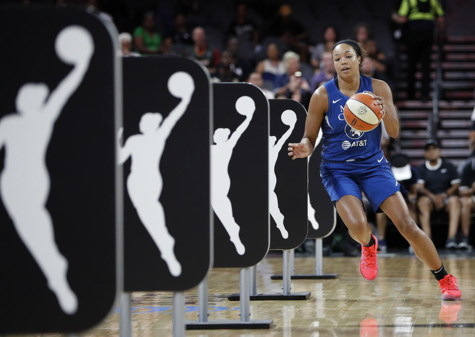 FILE - Minnesota Lynx's Napheesa Collier competes in the skills challenge during the WNBA All-Star festivities Friday, July 26, 2019, in Las Vegas. March Madness may have been the last time for fans to see many of the talented college women players compete. Players' options for professional basketball careers are limited, whether in the U.S. or overseas — the jobs just aren't there. (AP Photo/John Locher, File)