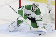 Dallas Stars goaltender Jake Oettinger (29) defends the net against against the Minnesota Wild during the first period of Game 4 of an NHL hockey Stanley Cup first-round playoff series Sunday, April 23, 2023, in St. Paul, Minn. (AP Photo/Stacy Bengs)