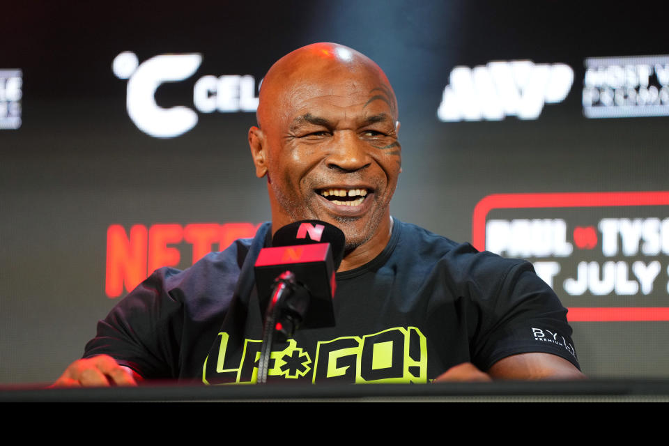 ARLINGTON, TEXAS - MAY 16: Mike Tyson speaks onstage during the Jake Paul vs. Mike Tyson Boxing match Arlington press conference at Texas Live! on May 16, 2024 in Arlington, Texas.  (Photo by Cooper Neill/Getty Images for Netflix)