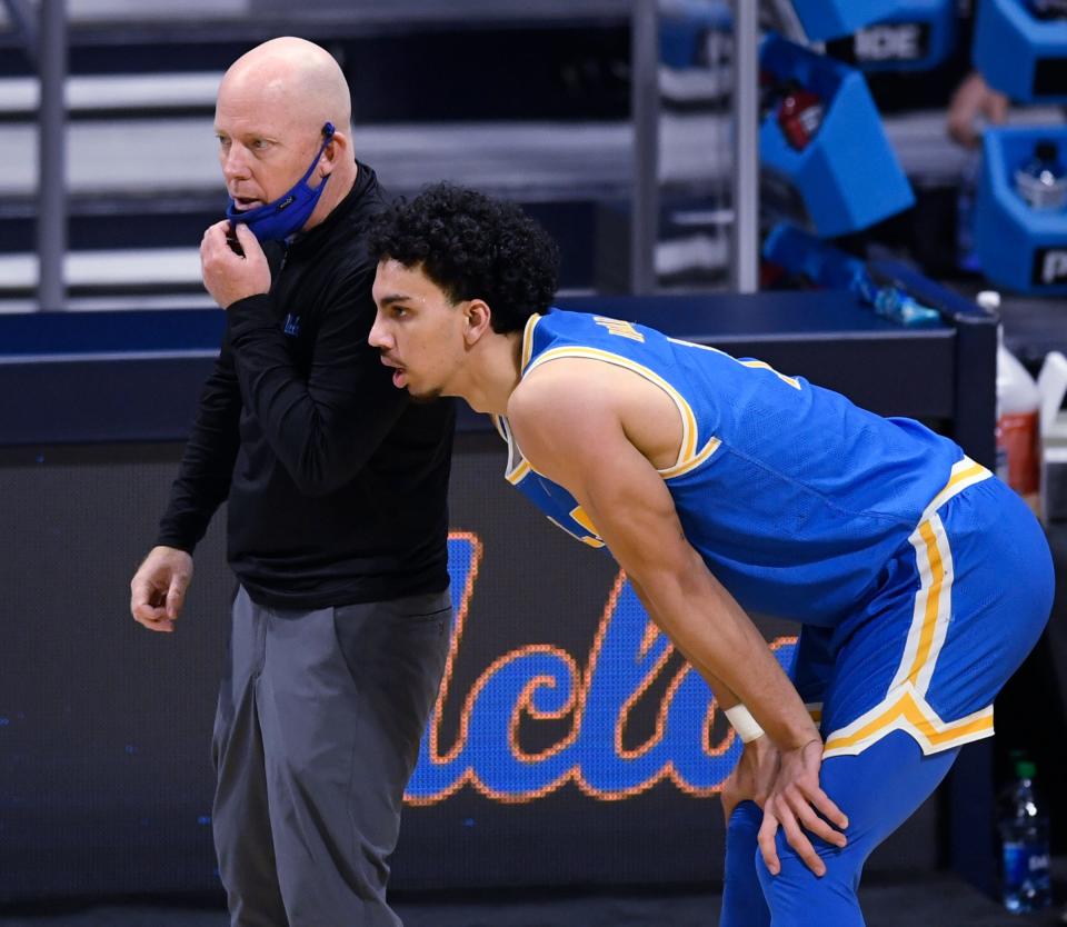 UCLA Bruins head coach Mick Cronin talks with a player during the Sweet Sixteen round of the 2021 NCAA Tournament on Sunday, March 28, 2021, at Hinkle Fieldhouse in Indianapolis, Ind.