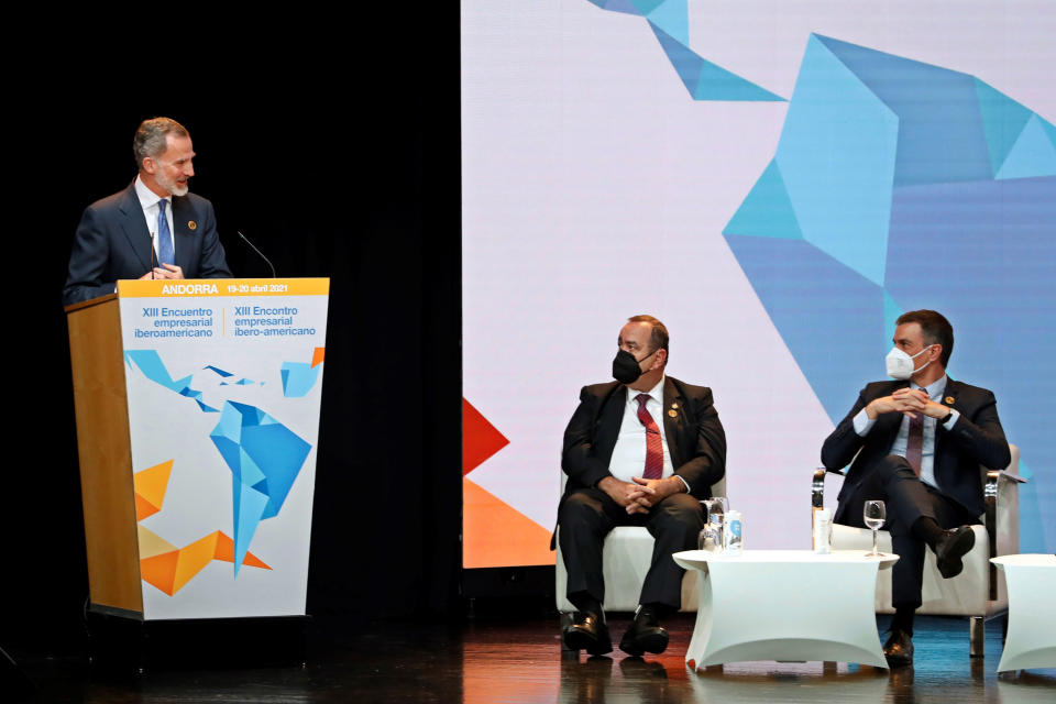 The President of Guatemala, Alejandro Giammattei, centre and Pedro Sanchez listen as Spain's King Felipe VI makes a speech during the Latin American leaders' summit in Andorra la Valla in Andorra, Tuesday April 20, 2021. Leaders from Latin American countries, Portugal, Spain and Andorra, are set to push for universal access to vaccines and flexible funding for economic recovery at their first summit since the pandemic started. (Alberto Estevez/Pool via AP)