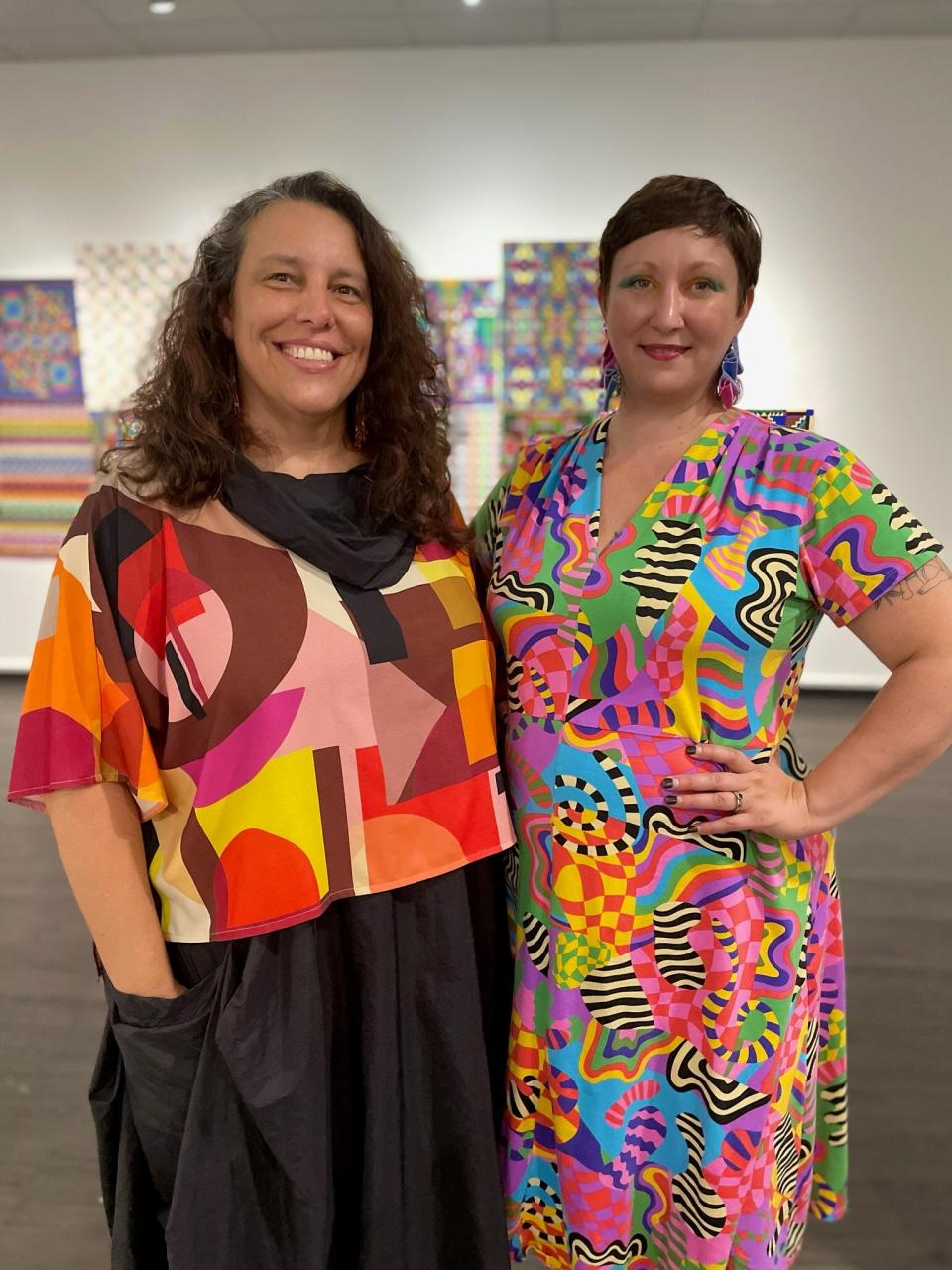 Former Bingham Gallery director Catherine Armbrust and current director Madeleine LeMieux pose at the reception for an exhibit of work by the late Joanne Berneche at the University of Missouri.