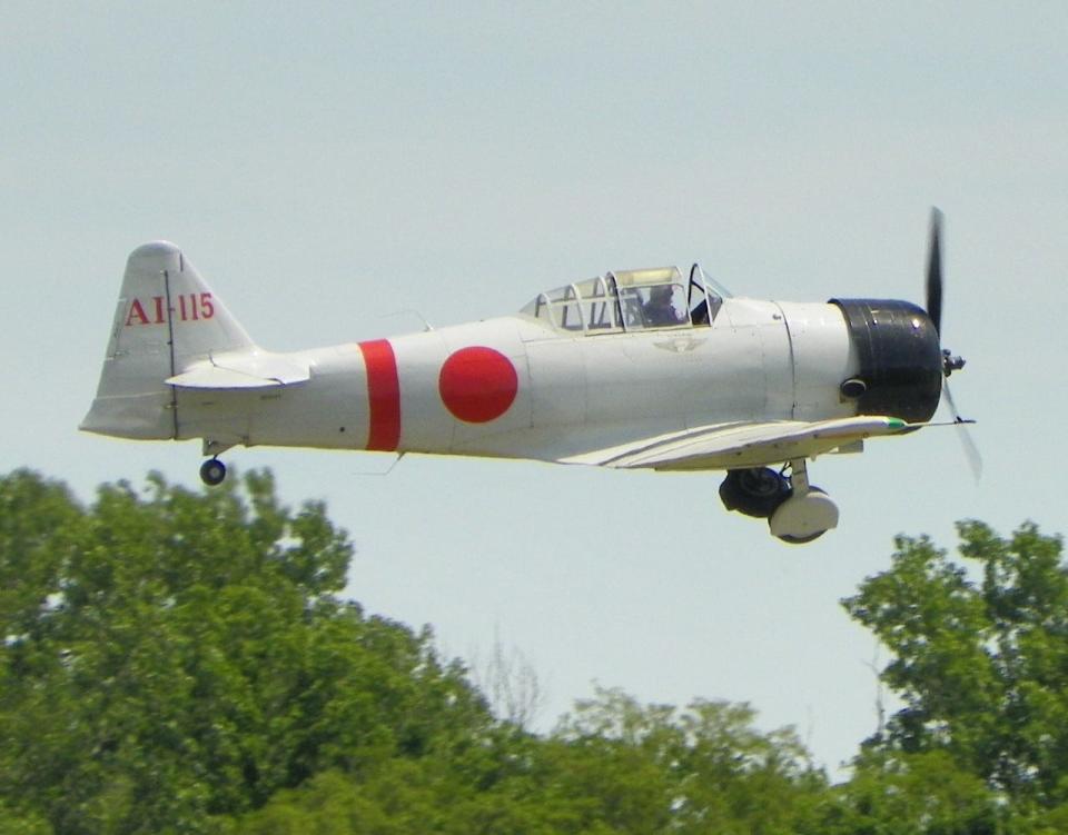 A replica Japanese Zero flys over Branch County Memorial Airport.