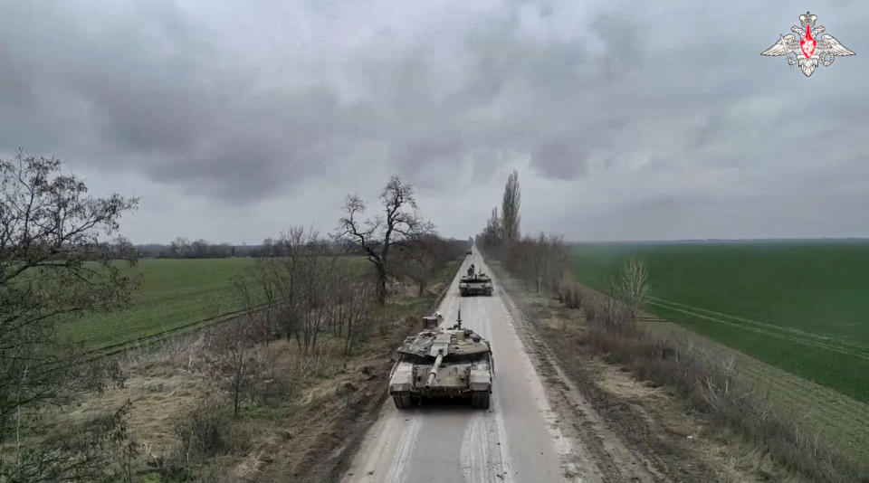 In this photo taken from video and released by Russian Defense Ministry Press Service on Monday, Jan. 23, 2023, Russian Army T-90M tanks roll to their position at an undisclosed location in Ukraine. (Russian Defense Ministry Press Service via AP)