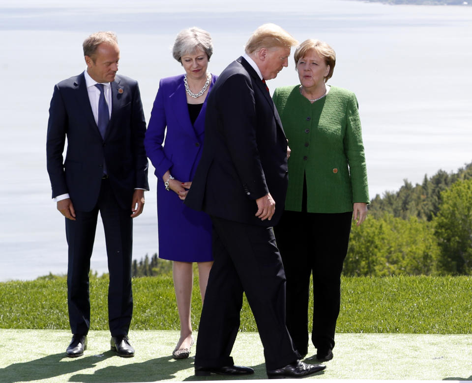 <p>European Council President Donald Tusk, Britain’s Prime Minister Theresa May and Germany’s Chancellor Angela Merkel look at U.S. President Donald Trump during a family photo at the G7 Summit in the Charlevoix city of La Malbaie, Quebec, Canada, June 8, 2018. (Photo: Yves Herman/Reuters) </p>