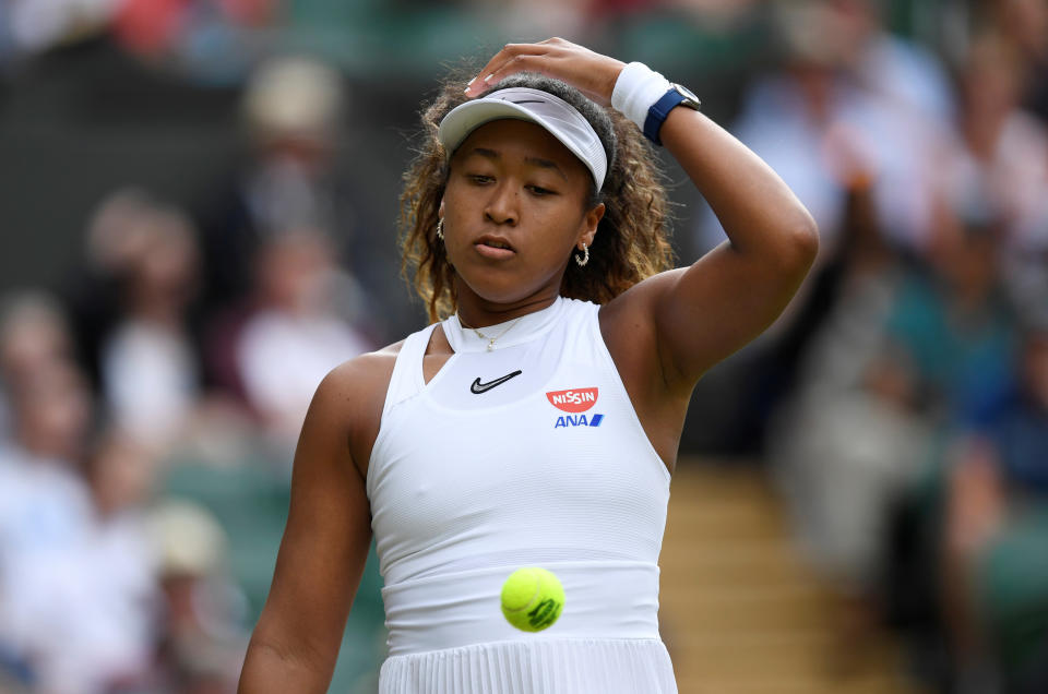 Tennis - Wimbledon - All England Lawn Tennis and Croquet Club, London, Britain - July 1, 2019  Japan's Naomi Osaka reacts during her first round match against Kazakhstan's Yulia Putintseva   REUTERS/Tony O'Brien