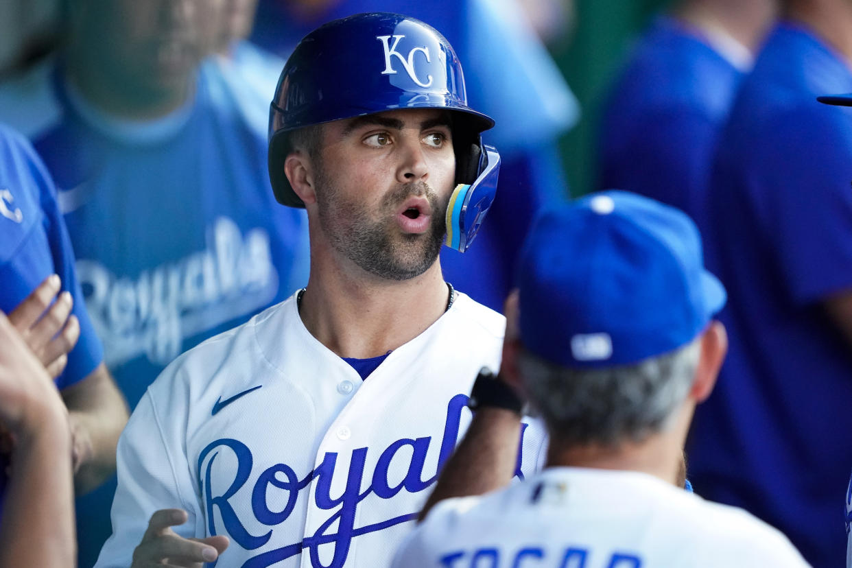 KANSAS CITY, MISSOURI - JUNE 28: Whit Merrifield #15 of the Kansas City Royals celebrates with teammates after scoring the first run against the Texas Rangers during the third inning at Kauffman Stadium on June 28, 2022 in Kansas City, Missouri. (Photo by Kyle Rivas/Getty Images)