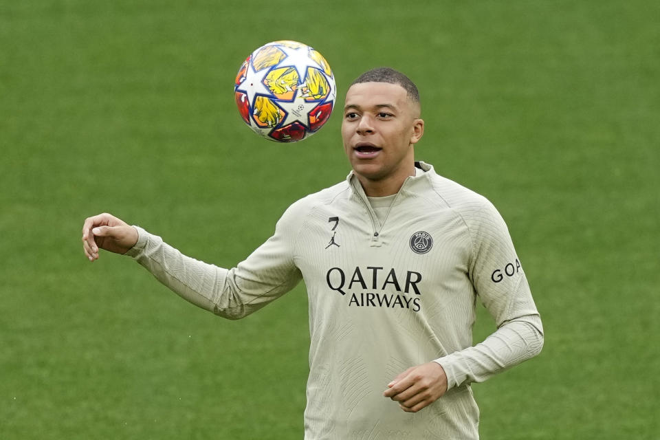 PSG's Kylian Mbappe exercises during training at his home stadium ahead of the first leg of the Champions League semi-final between Borussia Dortmund and Paris Saint-Germain at Signal-Iduna Park in Dortmund, Germany, Tuesday, April 30 2024. (AP Photo/ Martin Meissner)