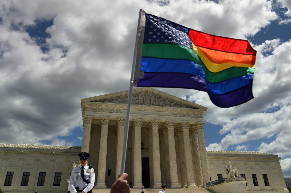 &nbsp;A supporter of gay marriage waves his rainbow flag in front of the U.S. Supreme Court in Washington, D.C., April 28, 2015. (Photo: The Washington Post via Getty Images)