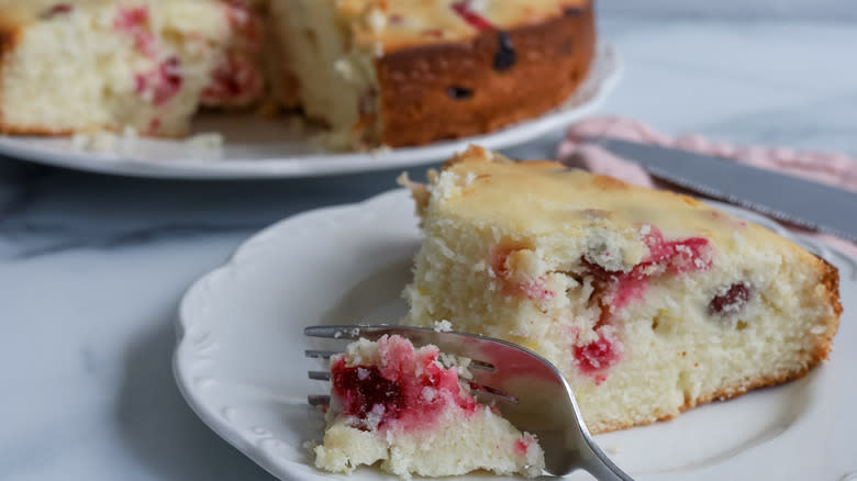 Slice of cranberry ricotta cake on plate 