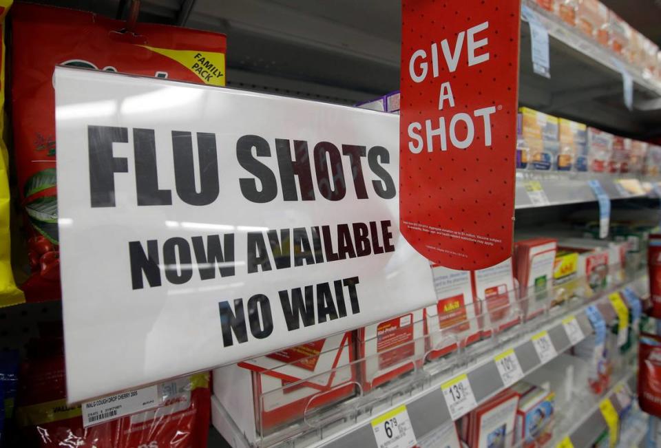 A sign telling customers that they can get a flu shot in a Walgreen store is seen Tuesday, Sept. 16, 2014, in Indianapolis. The nations biggest drugstores and retailers are grabbing larger chunks of the immunization market, giving customers more convenient options to protect themselves against the flu, pneumonia and more than a dozen other illnesses. (AP Photo/Darron Cummings) Darron Cummings/AP