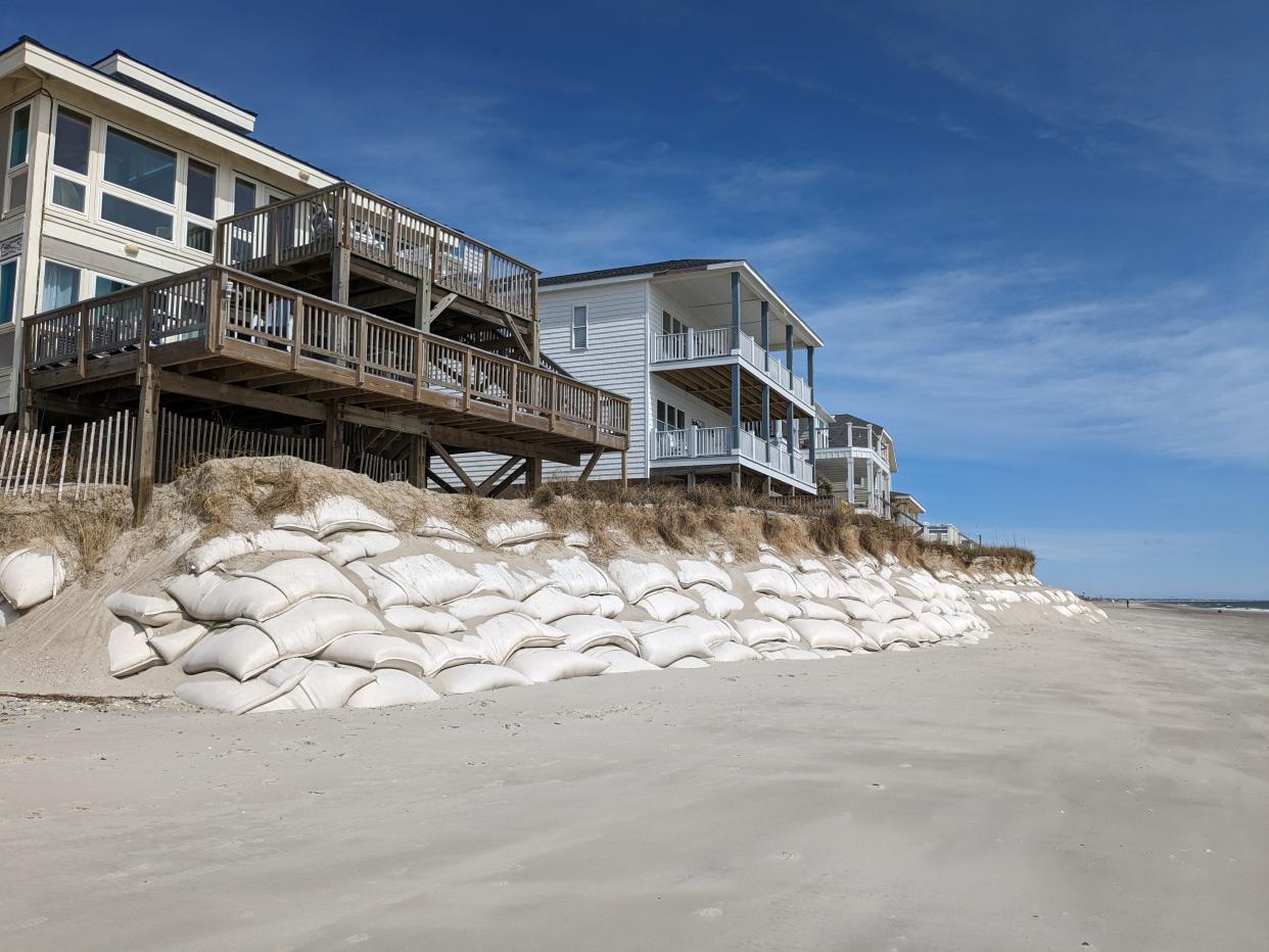 Years of storms and other heavy tide events have left numerous homes near the west end of Oak Island teetering on the edge. The town is hoping a beach nourishment planned for this winter can offer some protection for the threatened structures.