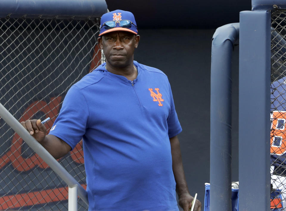 New York Mets hitting coach Chili Davis watches from the top of the dugout steps during the fifth inning of an exhibition spring training baseball game against the Houston Astros Monday, Feb. 25, 2019, in West Palm Beach, Fla. The millennial generation became a hot topic in Chicago when the Cubs fired hitting coach Chili Davis after they struggled to score in the final few days of last season, culminating in their 2-1, 13-inning loss to Colorado in the NL Wild Card Game. Davis told the Chicago Sun-Times that he needed to make some adjustments to how he delivers his message to millennials, and he planned to know more about his potential players before he accepted another job. He was hired as hitting coach for the New York Mets in December. (AP Photo/Jeff Roberson)