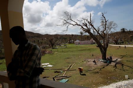 Children play in a damaged orphanage after Hurricane Matthew passes Jeremie, Haiti, October 11, 2016. REUTERS/Carlos Garcia Rawlins