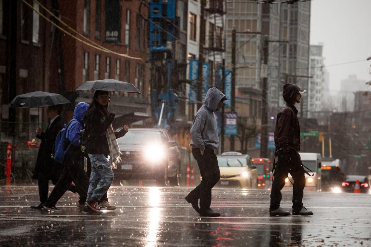 Heavy rain is falling on parts of the Lower Mainland on Tuesday, while cool, wet conditions are moving through the province's northeast where wildfires are burning. (Ben Nelms/CBC - image credit)