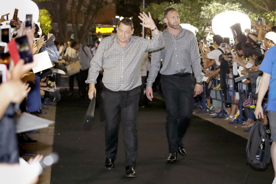 New Zealand All Blacks' Kieran Read, right, and coach Steve Hansen, left, arrive at a camp venue for the Rugby World Cup in Kashiwa, near Tokyo, Monday, Sept. 9, 2019. (Kyodo News via AP)