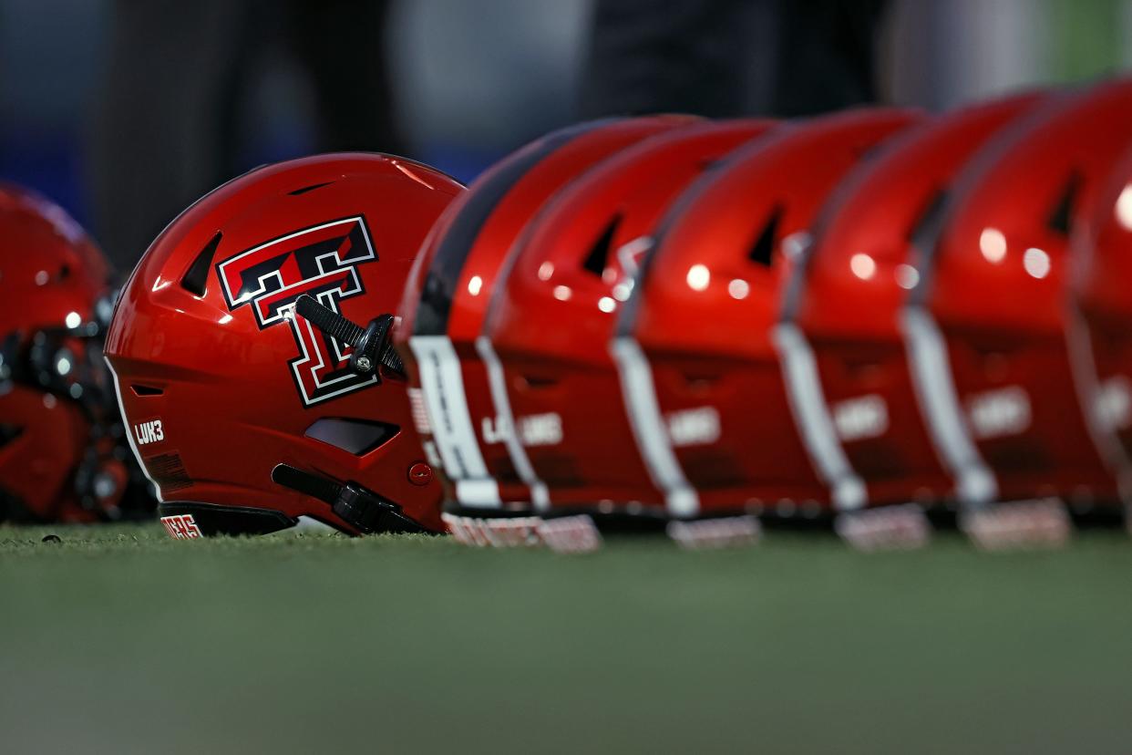 Texas Tech helmets on the field before the Liberty Bowl NCAA college football game on Tuesday, Dec. 28, 2021, in Memphis, Tenn.