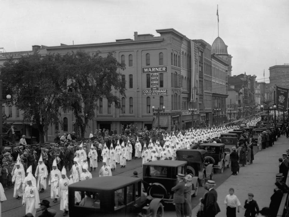 <p>Ku Klux Klan members hold a march in Binghampton, New York. (Photo: Getty Images </p>