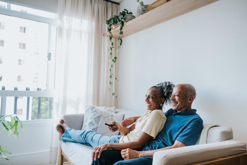 senior couple watching movies