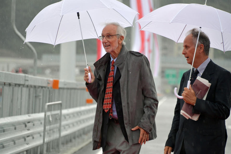 Renzo Piano, left, walks along the new San Giorgio Bridge being inaugurated in Genoa, Italy, Monday, Aug. 3, 2020. Two years ago this month, a stretch of roadbed collapsed on Genoa's Morandi Bridge, sending cars and trucks plunging to dry riverbed below and ending 43 lives. On Monday, Italy's president journeys to Genoa for a ceremony to inaugurate a replacement bridge. Designing the new span was Genoa native, Renzo Piano, a renowned architect. (Gian Mattia D'Alberto/LaPresse via AP)