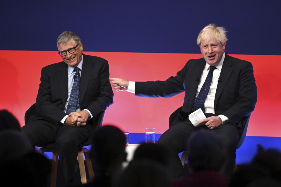 Britain's Prime Minister Boris Johnson, right, appears on stage in conversation with American Businessman Bill Gates during the Global Investment Summit at the Science Museum, London, Tuesday, Oct, 19, 2021. (Leon Neal/Pool Photo via AP)