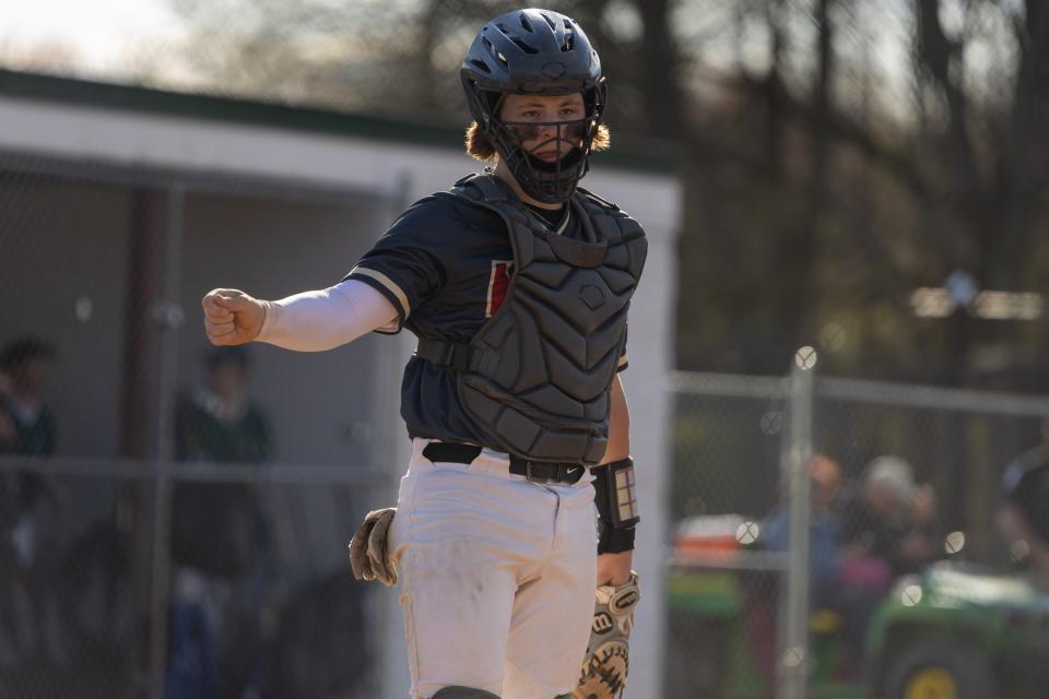 New Brighton catcher Brock Budacki (0) looks towards his manager Bob Zahn during the Lions WPIAL Class 2A section battle against Laurel on April 22.