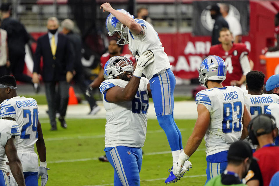 Detroit Lions kicker Matt Prater (5) celebrates after kicking the game winning field goal with teammate Tyrell Crosby (65) during the second half of an NFL football game against the Arizona Cardinals, Sunday, Sept. 27, 2020, in Glendale, Ariz. The Lions won 26-23. (AP Photo/Rick Scuteri)