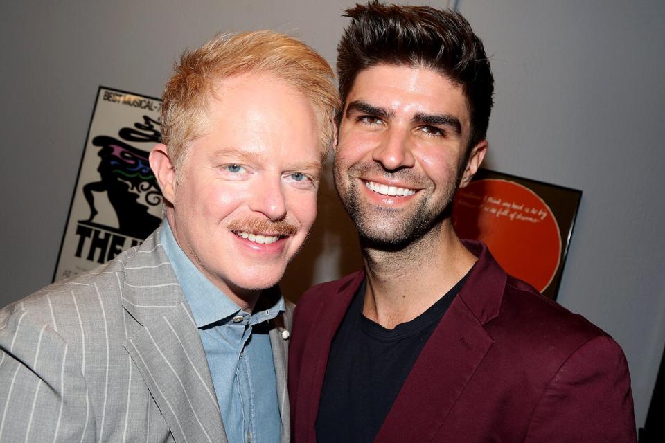 Jesse Tyler Ferguson and husband Justin Mikita pose at the 2022 Outer Critics Circle Awards at The New York Public Library