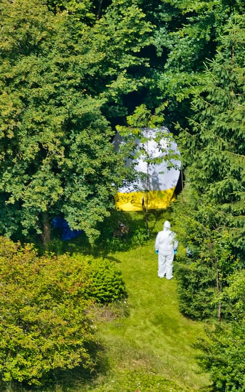 An aerial view of what is believed to be the body of the victim under a tarpaulin - Credit: INS