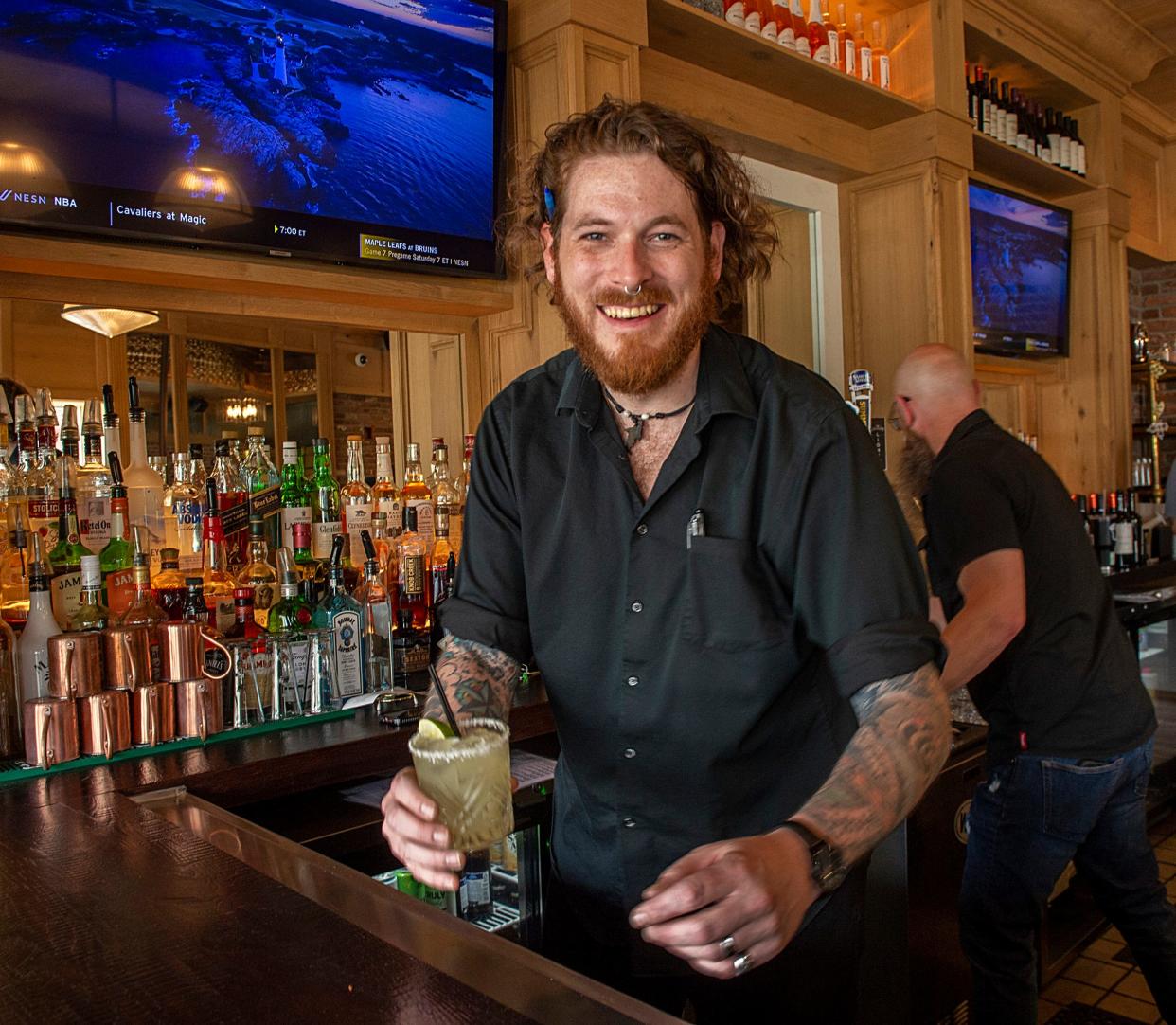 Sean Reid, a bartender at Lockheart Restaurant in Wellesley, is ready to serve up a margarita, May 3, 2024.