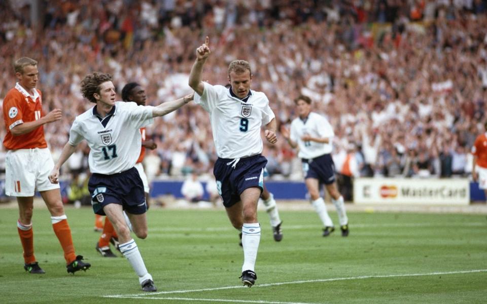 Steve McManaman helps Alan Shearer celebrate his second goal for England against Holland in the Group A match at Wembley during the European Football Championships - Getty Images