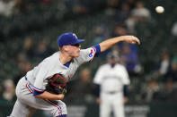 Texas Rangers relief pitcher Kolby Allard throws to a Seattle Mariners batter during the first inning of a baseball game Thursday, May 27, 2021, in Seattle. (AP Photo/Elaine Thompson)