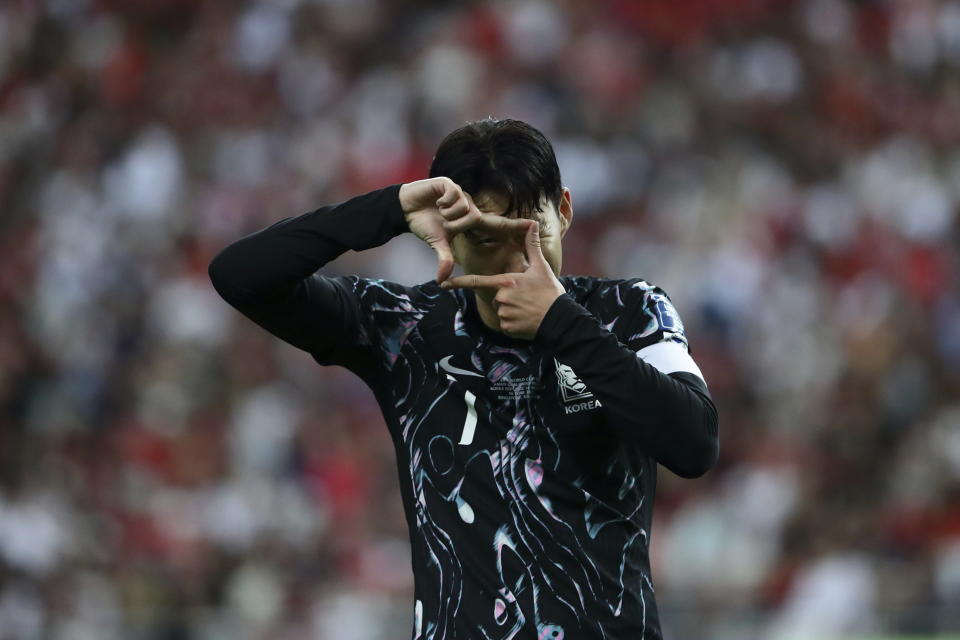 Son Heung Min of South Korea reacts after scoring a goal during 2026 World Cup Asian 2nd qualifying soccer match between Singapore and South Korea at the National Stadium on Thursday June 6, 2024 in Singapore. (AP Photo/Suhaimi Abdullah)