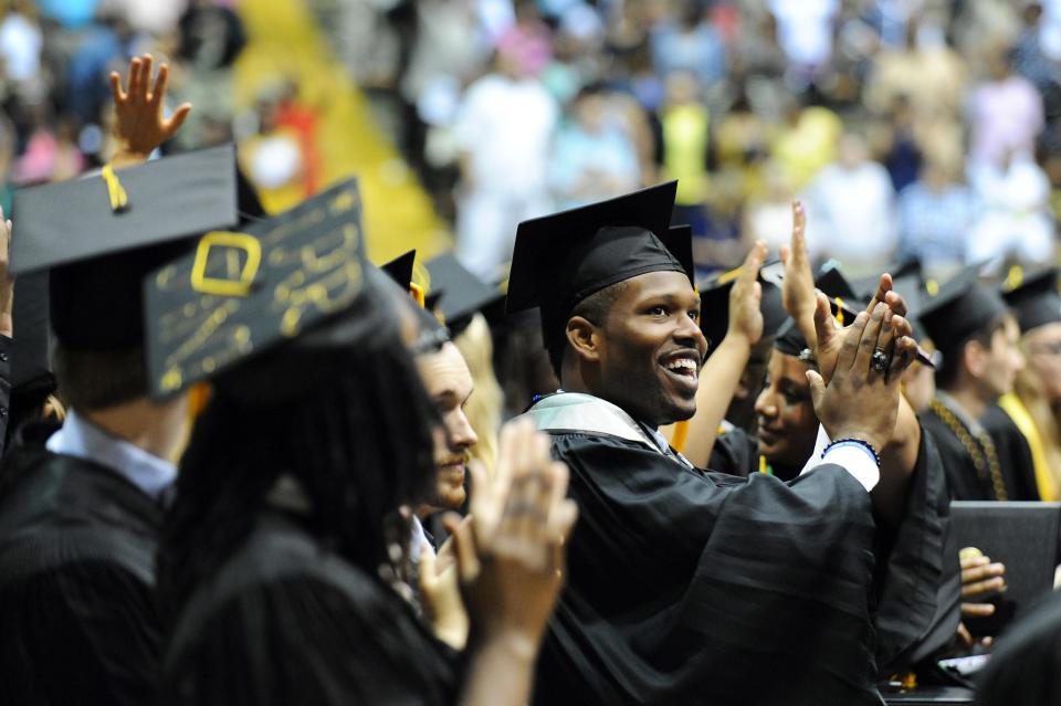 University of Mississippi graduates celebrate after receiving their diploma during a previous spring graduation ceremony at Reed Green Coliseum in Hattiesburg.