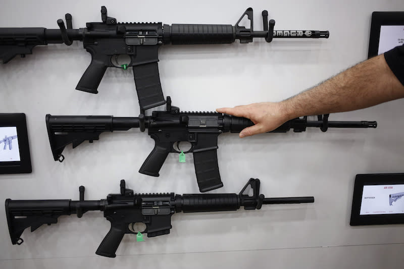 AR-15 rifles are seen here on display at the National Rifle Association’s annual meeting in Louisville, Ky., on May 20, 2016. This firearm was the weapon used at several mass shootings in the U.S., including the most recent one at a high school in Parkland, Fla. Photo from Getty Images.