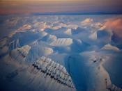 From 15,000 feet (4,580 meters), Spitsbergen looks inhospitable. Whalers, scientists, and Arctic explorers have used Svalbard as a base, but only 2,500 call the islands home.