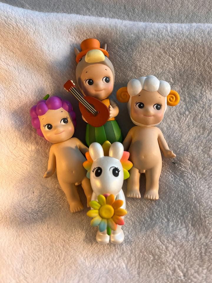 Mikayla Buneta's collection of Sonny Angel figurines includes three traditional characters and one Robby figurine, which is considered rare.