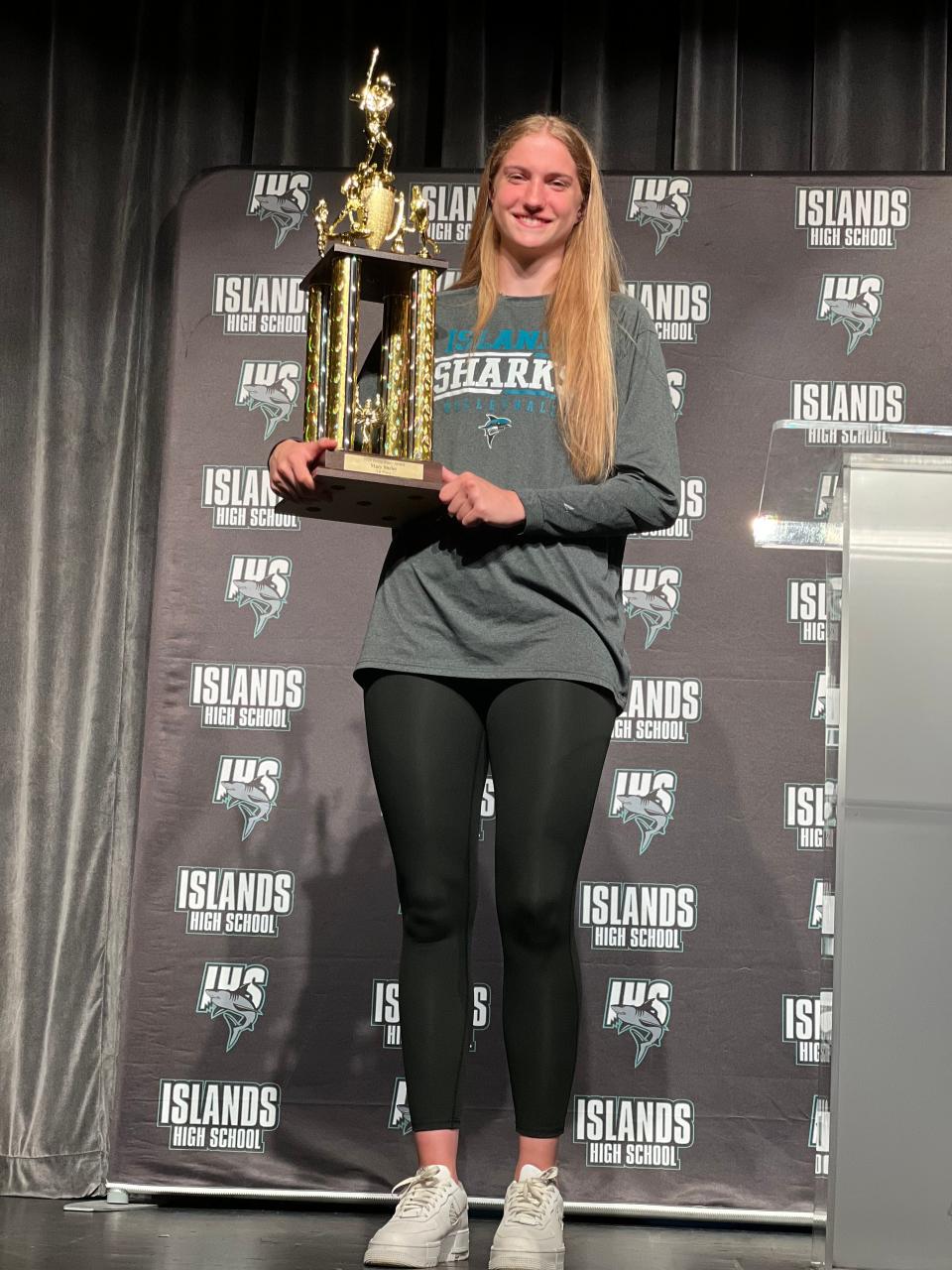 Veronica Sierzant of Islands poses with the 2022 Hollis Stacy Award trophy. The junior won the award for the second year in a row.