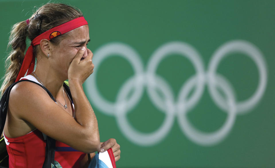 FILE - In this Aug. 13, 2016, file photo, Monica Puig, of Puerto Rico, cries after winning the gold medal match in the women's tennis competition at the 2016 Summer Olympics in Rio de Janeiro, Brazil. Puig announced her retirement from professional tennis at age 28 via a post on social media Monday, June 13, 2022. (AP Photo/Vadim Ghirda, File)