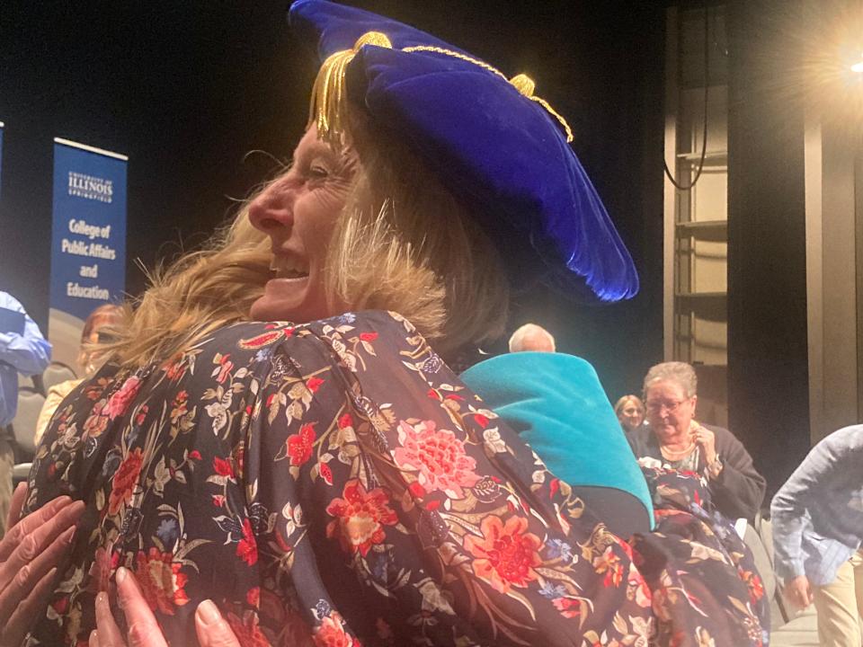 University of Illinois Springfield Chancellor Janet Gooch greets friends and family members after her investiture ceremony at Sangamon Auditorium Wednesday.