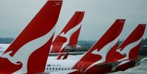 FILE PHOTO: Qantas aircraft are seen on the tarmac at Melbourne International Airport in Melbourne