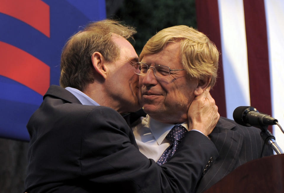 FILE - In an Aug. 4, 2010 file photo, attorney David Boies kisses fellow lawyer Theodore Olson on the cheek at a public rally in West Hollywood, Calif. Olson and Boies fought on opposite sides of the case that determined the 2000 presidential election, but the veteran attorneys joined forces to defeat California’s gay-marriage ban, a five-year effort documented in “The Case Against 8,” which premiered at the Sundance Film Festival. The film follows the attorneys and plaintiffs in the lawsuit that resulted in the marriage ban being overturned. “The Case Against 8” is set to air on HBO in June. (AP Photo/Adam Lau, File)