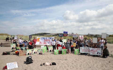 Trump protestors on the beach near to the Trump Turnberry resort in South Ayrshire - Credit: PA