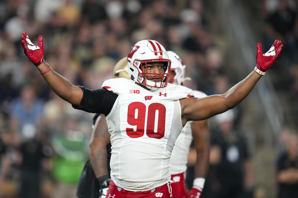 Wisconsin defensive end James Thompson Jr. (90) celebrates a sack against Purdue during the first half of an NCAA college football game in West Lafayette, Ind., Friday, Sept. 22, 2023. (AP Photo/Michael Conroy)