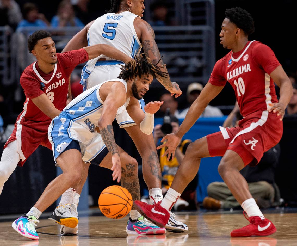 North Carolina’s Armando Bacot (5) sets a screen form R.J. Davis (4) in the second half against Alabama during the NCAA Sweet Sixteen on Thursday, March 28, 2024 at Crypto.com Arena in Los Angeles, CA.