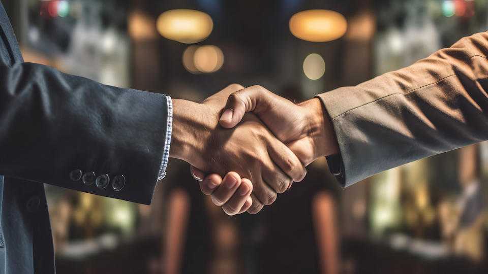 Businessman handshake for teamwork of business merger and acquisition,successful negotiate,hand shake,two businessman shake hand with partner to celebration partnership and business deal